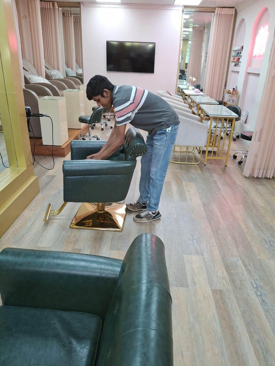Huzeifa setting up Eliseo Salon for the busy day ahead